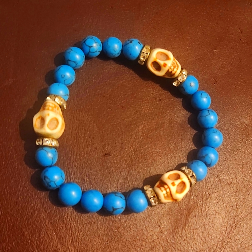 Turquoise and skeleton stretch bracelet.